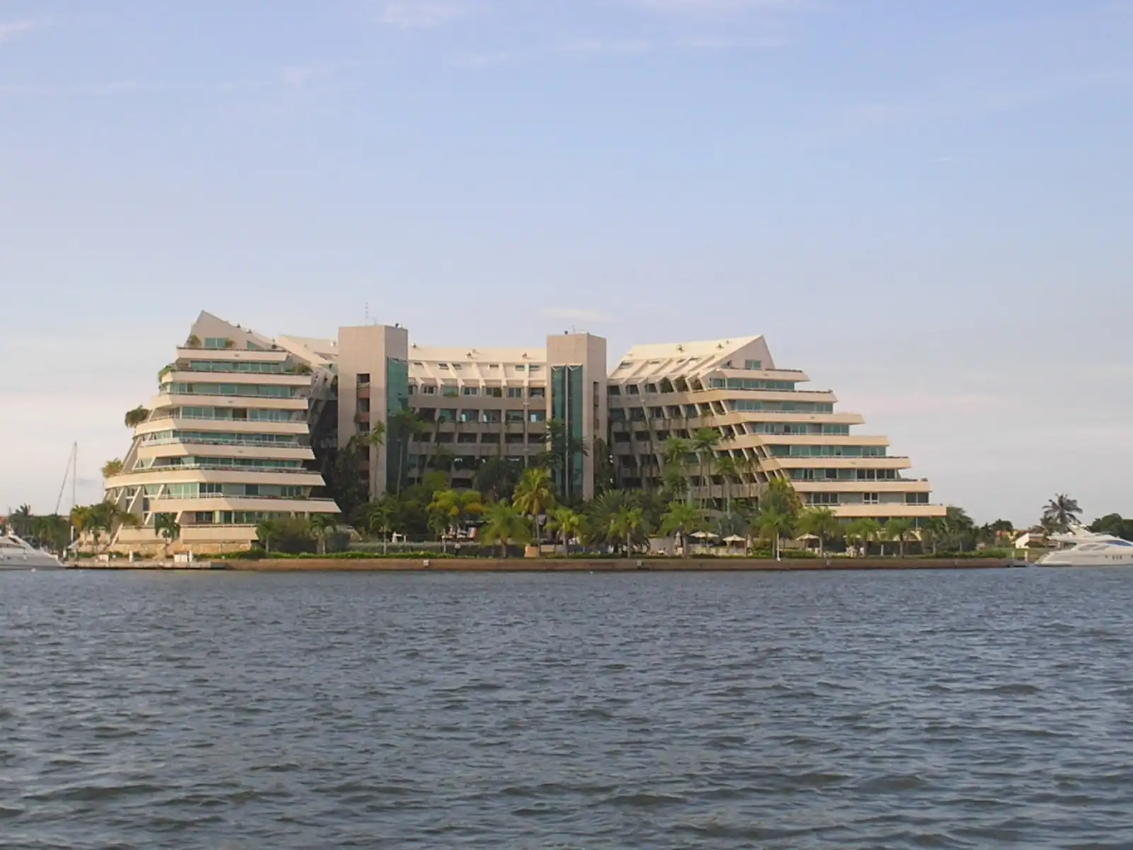 Artificial Residential Island with blue windows located in a canal